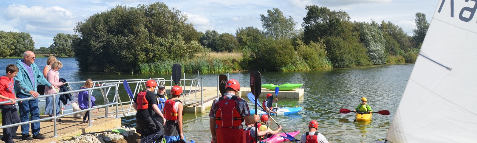 Conningbrook Lake people and canoes.jpg